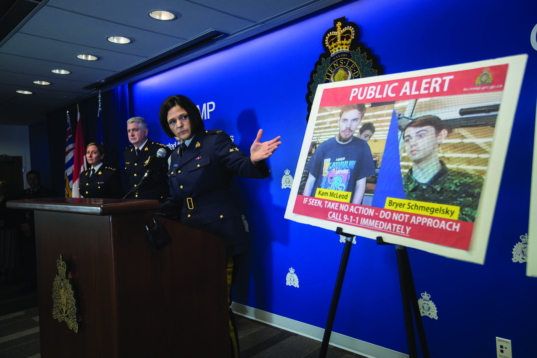 Security camera images recorded in Saskatchewan of Kam McLeod, 19, and Bryer Schmegelsky, 18, are displayed as RCMP Sgt. Janelle Shoihet speaks during a news conference in Surrey, B.C., on Tuesday July 23, 2019. RCMP say two British Columbia teenagers who were first thought to be missing are now considered suspects in the deaths of three people in northern B.C. The bodies of Australian Lucas Fowler, his girlfriend Chynna Deese, of Charlotte, N.C., and an unidentified man were found a few kilometres from the teens’ burned-out vehicle. THE CANADIAN PRESS/Darryl Dyck