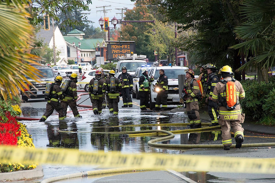 Emergency crews responded to a fire on the balcony of a top-floor unit in a Langford apartment building Thursday afternoon. Goldstream Avenue was closed for a number of hours while firefighters extinguished the blaze. (Nina Grossman/News Staff)