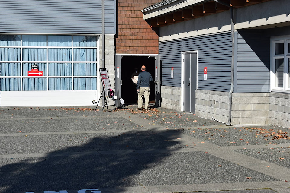 This was the line-up outside Sidney’s Mary Winspear Centre at around 2:30 p.m. Saturday. The short-up line speaks to the high number of votes, which have already been cast against the backdrop of COVID-19 by mail or in advanced voting. Voters, however, unanimously praised the safety measures in place, as well the convenience of the polling stations. (Wolf Depner/News Staff)