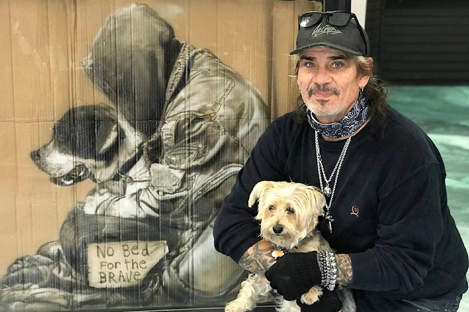 Victoria-based artist Paul Archer poses with one of his striking images of a veteran. Completing such paintings has become a November tradition. (Kendra Crighton/News Staff) Paul Archer, a Victoria-based artist, tries to paint one Remembrance Day piece each year in November. (Kendra Crighton/News Staff)