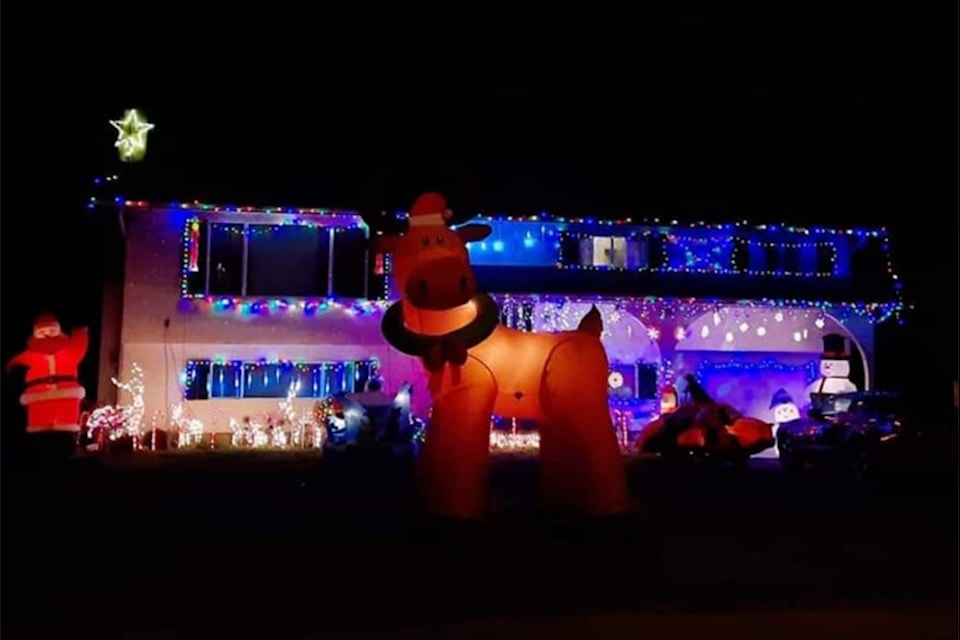 Jackie Kightly’s Sooke home is in the spirit. Located at 7020 West Coast Road, Kightly’s display includes a garage door snowman, hanging “icicles” and candy light-filled shrubs. (Courtesy of Jackie Kightly)