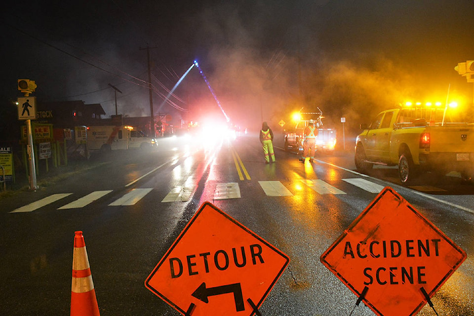 Fire, ambulance and other emergency personnel were on hand dealing with an early-morning fire in Coombs on Jan. 3, 2021. (Peter McCully photo)