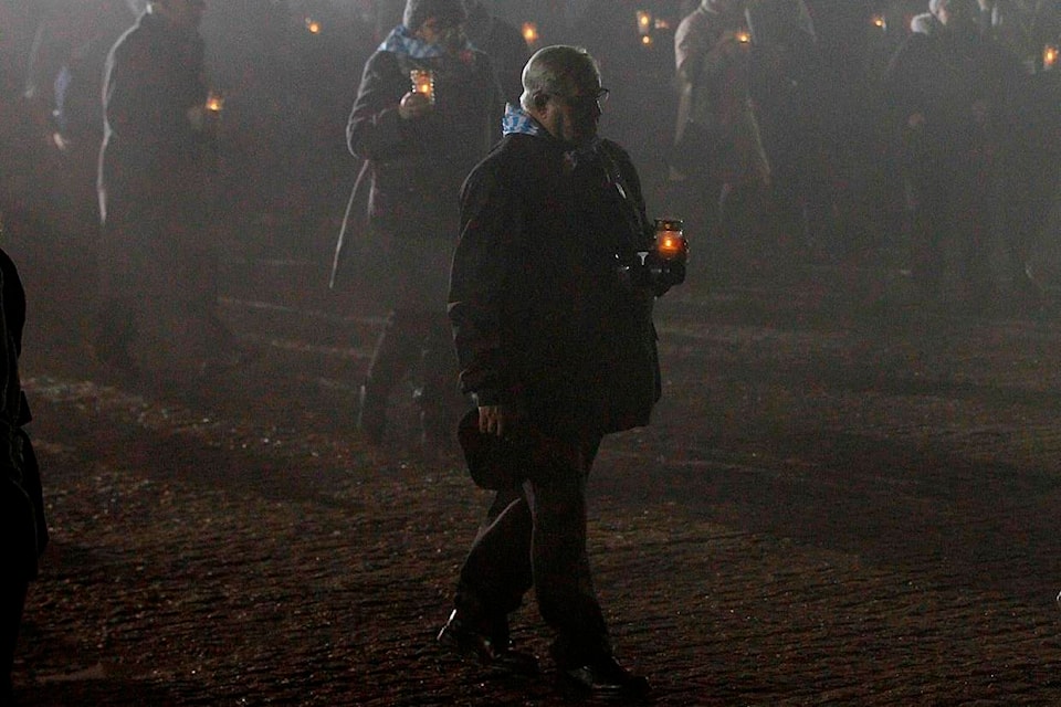 File - In this Saturday, Jan. 27, 2018 file photo, survivors of the Nazi death camp Auschwitz arrive for a commemoration ceremony on International Holocaust Remembrance Day at the International Monument to the Victims of Fascism inside Auschwitz-Birkenau in Oswiecim, Poland. The commemorations for the victims of the Holocaust at the International Holocaust Remembrance Day, marking the liberation of Auschwitz-Birkenau on Jan. 27, 1945, will be mostly online this year due to the coronavirus pandemic. (AP Photo/Czarek Sokolowski, file)