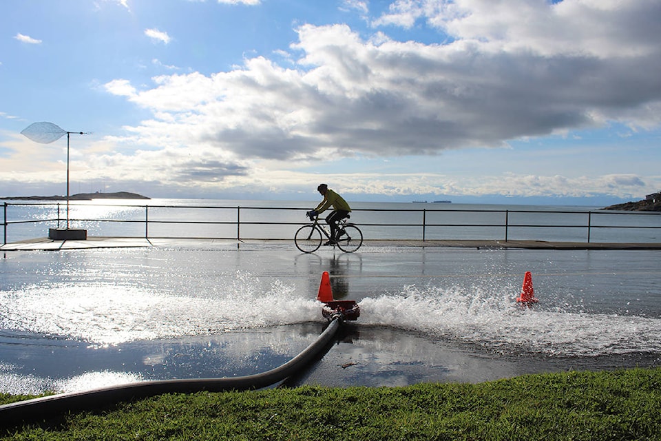 A cyclist travels Beach Drive at McNeill Bay during routine water testing on Feb. 3. (Travis Paterson/News Staff)
