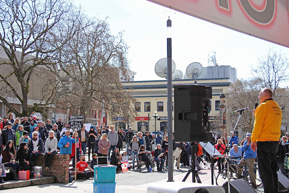 Over 150 people were gathered in Centennial Square by 1 p.m. March 20 to listen to speakers decry COVID-19 restrictions. (Jane Skrypnek/News Staff)