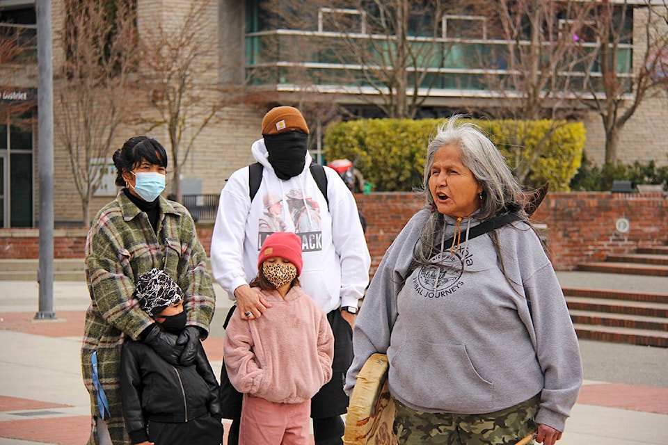 An Indigenous Elder speaks to a group of a couple dozen Indigenous people and allies gathered at Centennial Square March 27. (Jane Skrypnek/News Staff)