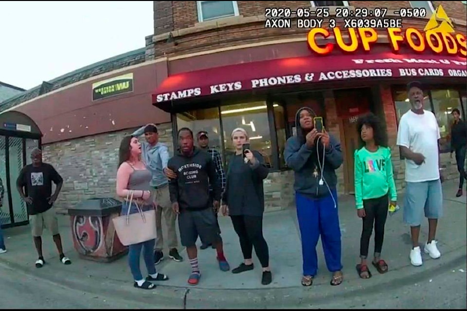 This image from a police body camera shows people gathering as former Minneapolis police officer Derek Chauvin was recorded pressing his knee on George Floyd’s neck for several minutes as onlookers yelled at Chauvin to get off and Floyd saying that he couldn’t breathe on May 25, 2020 in Minneapolis. From the moment a bystander filmed the incident, video shaped the public’s understanding of Floyd’s death. (Minneapolis Police Department via AP)