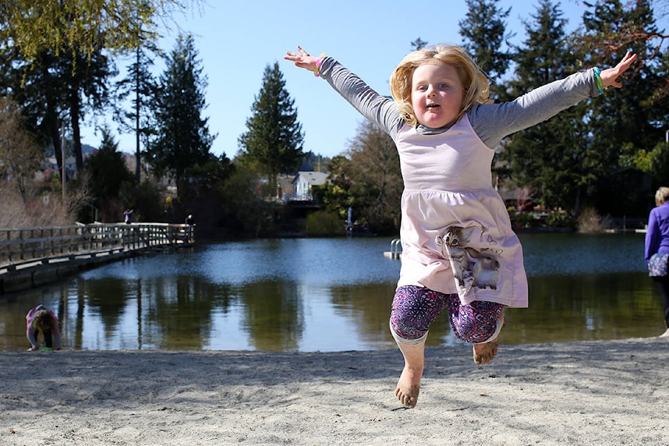 Madison soaks up the sunshine with her family at at Langford Lake on April 5. (Dawn Gibson/News Staff)