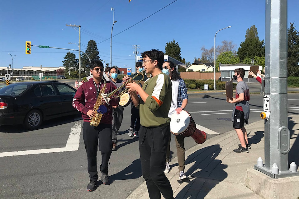 Students take to the streets, here at Gordon Head Road and McKenzie Avenue, to protest potential cuts to music in the Greater Victoria School District on Thursday (April 22). (Photos courtesy Saanvi Katireddy)