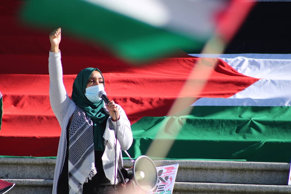 Demonstrators called on Canada to stop military exports to Israel at the the B.C. legislature on May 20. (Jake Romphf/ News Staff)