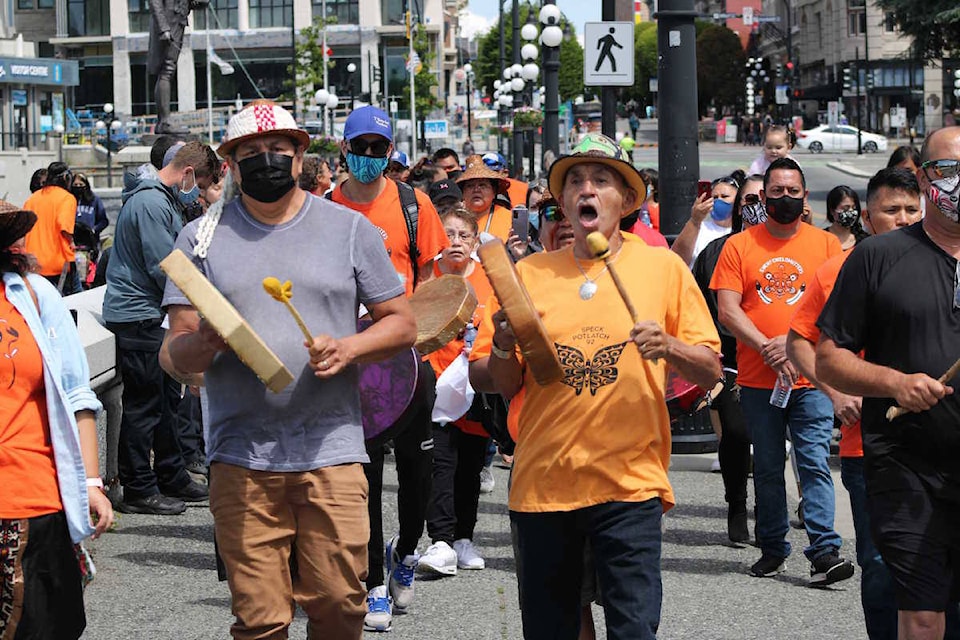 Vancouver Island First Nations and others gathered near Victoria’s harbour and on the lawn of the legislature to honour the 215 children who never came home from a Kamloops residential school. (Jake Romphf/News Staff)