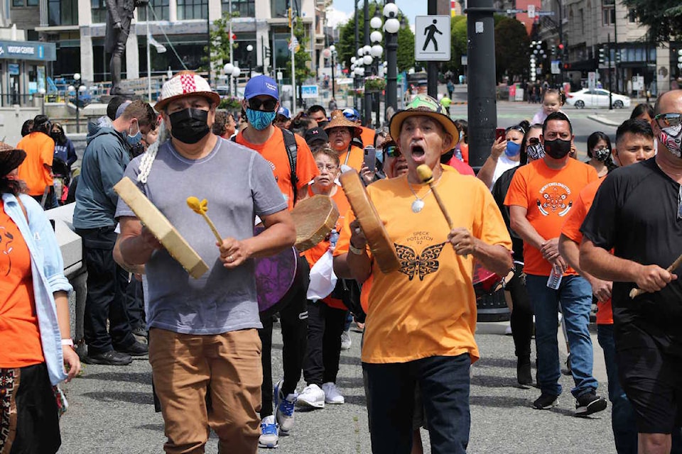 Vancouver Island First Nations and others gathered near Victoria’s harbour and on the lawn of the legislature to honour the 215 children who never came home from a Kamloops residential school. (Jake Romphf/News Staff)