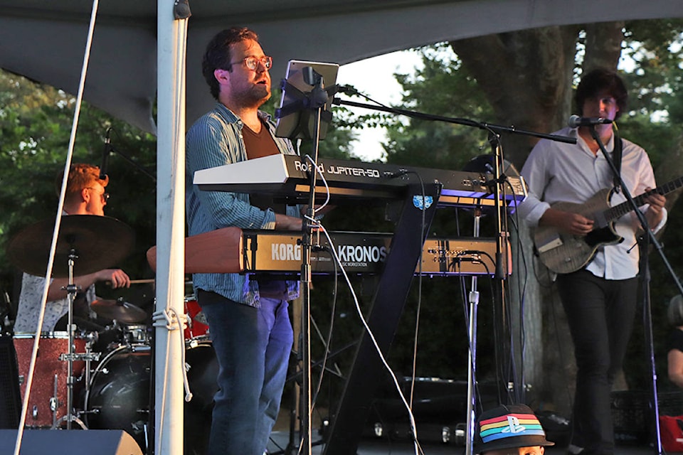 Alexander Ferguson, on keyboard and vocals, performs along with bandmates Alex Campbell on drums and Tyler Lieb on guitar at the Summer in the Park concert series Aug. 19 at Willows Park.
