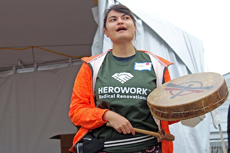 The sound of drums and melodic voices fill the air as Lizz Brooks leads the opening ceremony at Indigenous Perspectives Society. (Megan Atkins-Baker/News Staff)