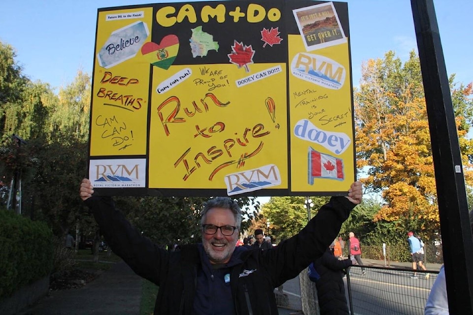 Fans cheer on the runners in the 2021 half marathon portion of the Royal Victoria Marathon. (Christine van Reeuwyk/News Staff)