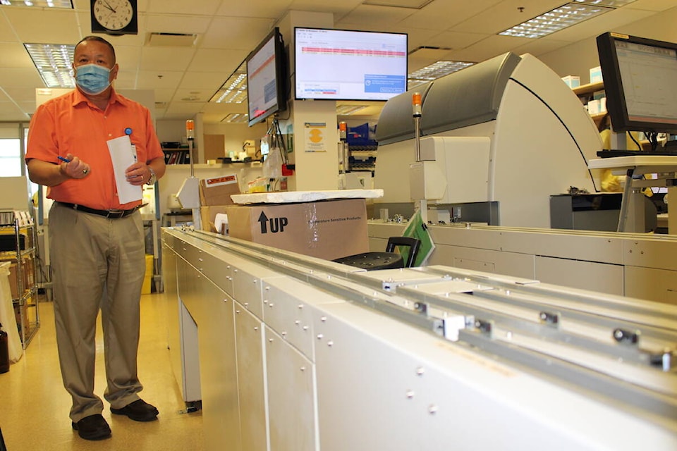 Wilson Louie, chief technologist at Royal Jubilee Hospital, stands by the hospital’s 20-year-old chemistry line. The Victoria Hospitals Foundation will be fundraising to replace the aging sample-processing machine. (Jake Romphf/News Staff)