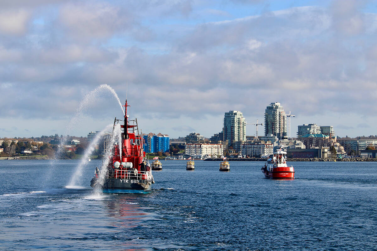 Representatives from the Victoria Fire Department, CFB Esquimalt, Victoria Harbour Ferry, Canadian Coast Guard, Prince of Whales Wildlife Adventures, Downtown Victoria Business Association, Destination Greater Victoria and the Greater Victoria Chamber of Commerce formed a flotilla to escourt the M.V. Coho into Victoria on Nov. 8, 2021. Amy Attas Photo.