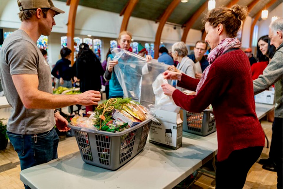 A group has gathered for nearly seven years in Oak Bay to create Christmas hampers. This year the party moves to Vic West. (Courtesy Joyce Kline)