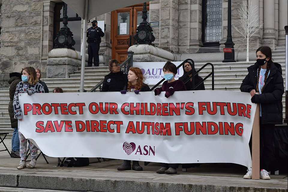 Children on the steps of the B.C. legislature rally for austim support. (Kiernan Green/News Staff)