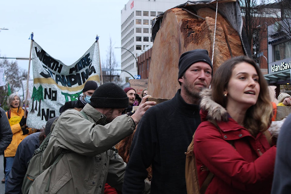 Old-growth forest supporters marched through Victoria on Nov. 24 as they called for all logging of the ancient trees to end. (Jake Romphf/News Staff)