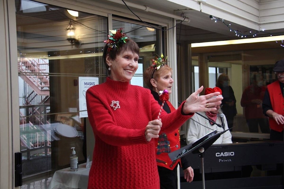 Carmen MacLean (left) and Pauline Price perform for guests at Monterey Recreation Centre in Oak Bay on Dec. 15. (Christine van Reeuwyk/News Staff)