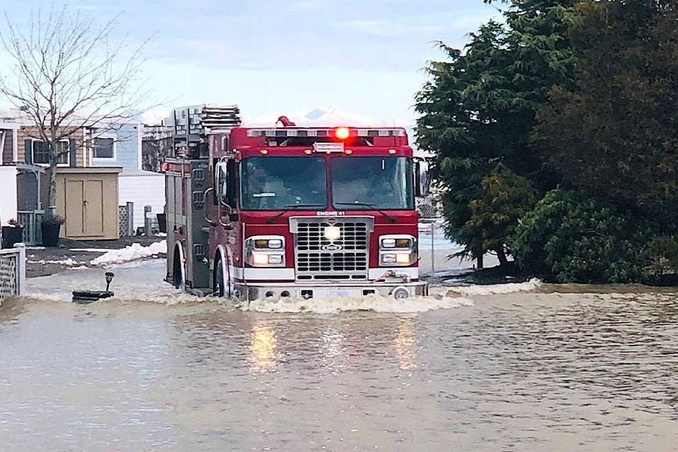 The Parksville Fire Department use their trucks to go through the flooded area at Surfside RV Resort on Friday, Jan. 7, 2022. (Michael Briones photo)