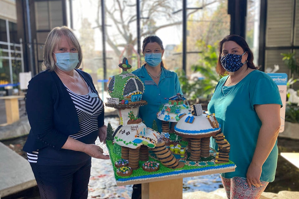 Kathy Ajas (left to right), Cheryl Chalifour, Kristina Quinn present their People’s Choice Award winning gingerbread creation, Revera Retirement 2050. (Courtesy of Habitat for Humanity)