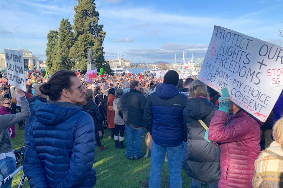 Hundreds of demonstrators gathered in front of the B.C. legislature Saturday to protest government mandates introduced during the pandemic. (Megan Atkins-Baker/News Staff)