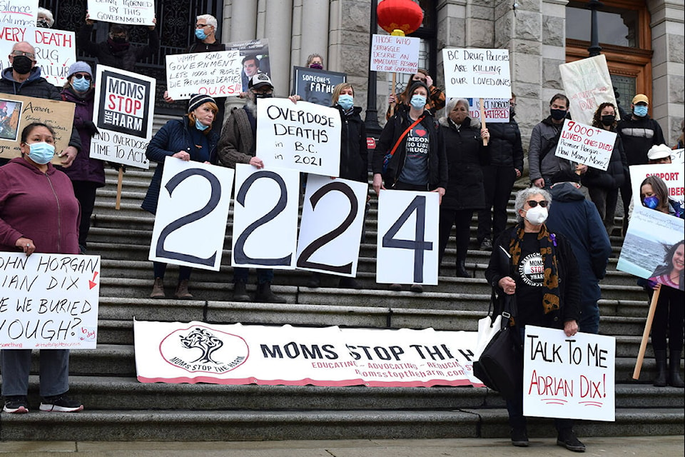 Leslie Mcbain (bottom left) stands with other Moms Stop the Harm group members gathered at the legislature Thursday morning to call for greater action on opioid overdose reduction. (Kiernan Green/News Staff)