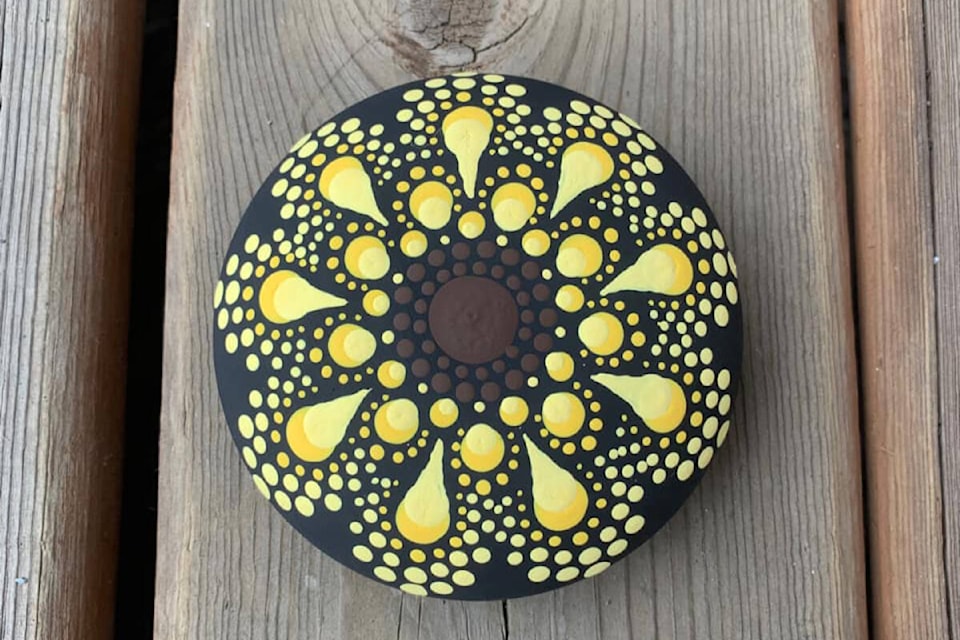 Members of the Vancouver Island Painted Rocks Facebook group are painting sunflowers in solidarity with Ukraine. (Christine Nemeth/Facebook)