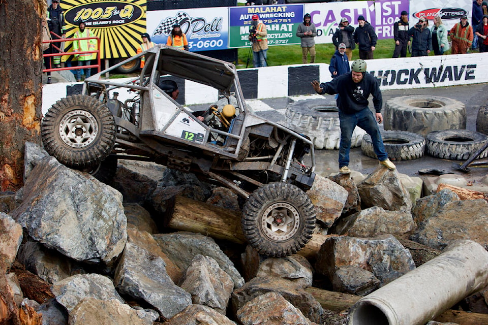 A competitor navigates an obstacle with the help of a spotter Saturday during the Island Cup extreme 4x4 competition at the Westshore Motorsports Park. (Justin Samanski-Langille/News Staff)