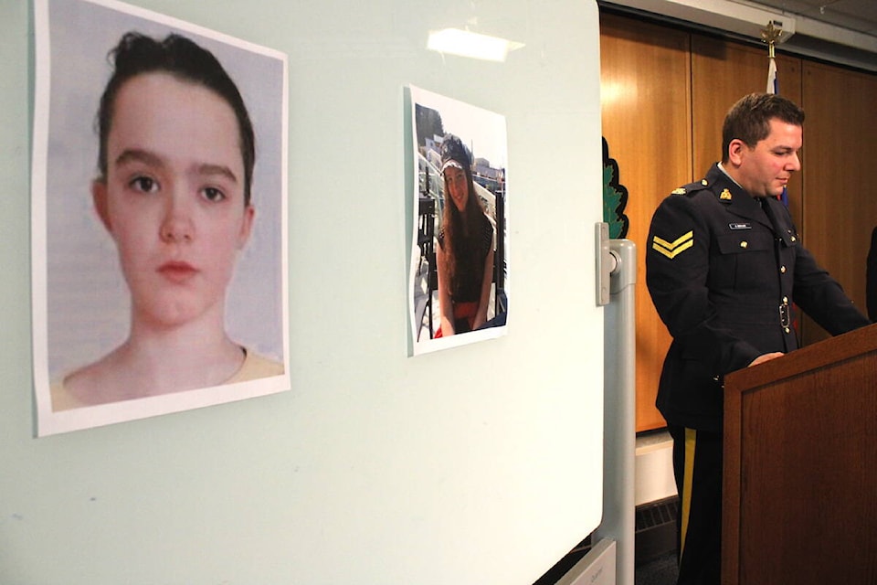 Photos of Payton MacDonald, who has been missing for two weeks, pinned up during a news conference in Victoria on March 31. (Jake Romphf/News Staff)