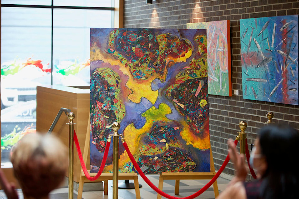 The Township Community Art Council is auctioning off ‘Community,’ a painting created by three of this year’s artists in residence, to fundraise for the council’s youth mentorship program. Bids are being accepted until May 6. (Justin Samanski-Langille/News Staff)