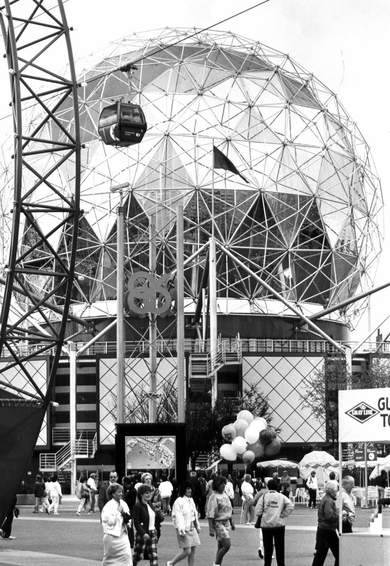 Visitors to Expo 86 in Vancouver, B.C. are dwarfed by the Expo Centre, an exhibit which contains a theatre and various displays. Twenty years after Expo 86 changed Vancouver to a destination point on tourism maps, both proponents and critics are looking back. (CP PICTURE ARCHIVE)