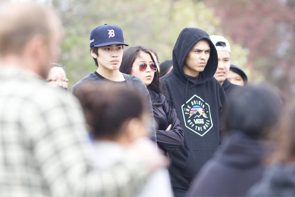 Mourners gathered for a ceremony May 11 at the site of the stabbing of a young man on Midnight Drive in Williams Lake. (Ruth Lloyd photo - Williams Lake Tribune)