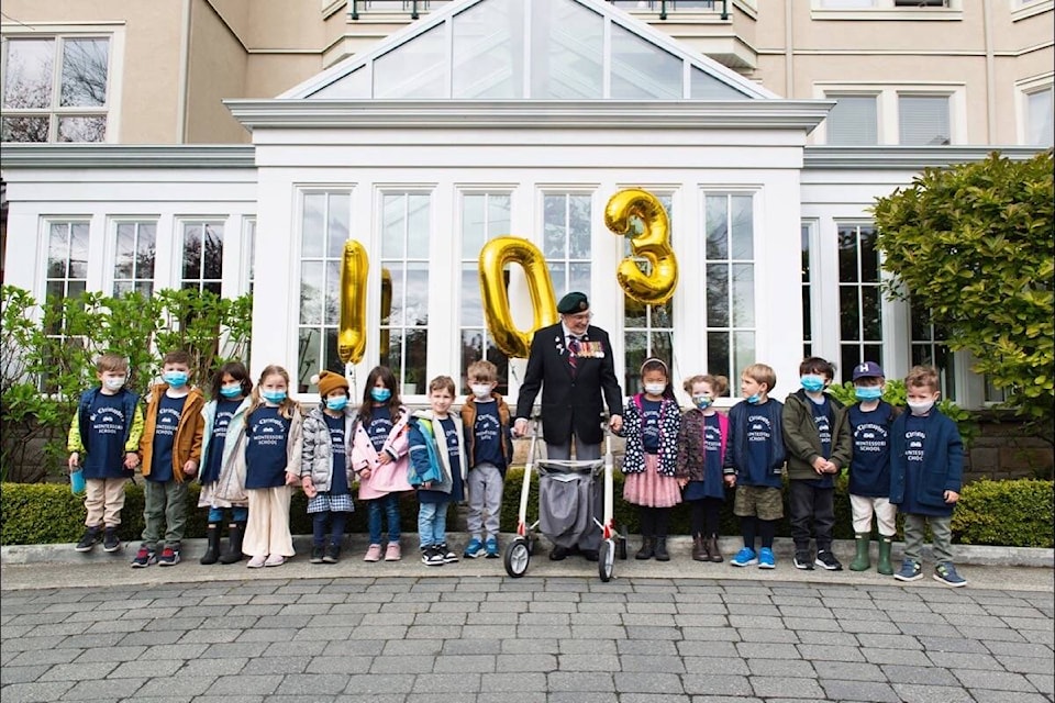 Kindergarten class from St. Christopher’s Montessori walks with John Hillman on May 3 in his fundraiser for Save the Children. (Courtesy Carlton House)
