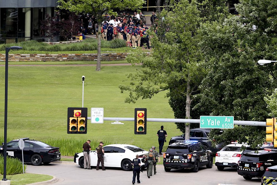 Tulsa police and firefighters respond to a shooting at the Natalie Medical Building Wednesday, June 1, 2022. in Tulsa, Okla. Multiple people were shot at a Tulsa medical building on a hospital campus Wednesday. (Ian Maule/Tulsa World via AP)