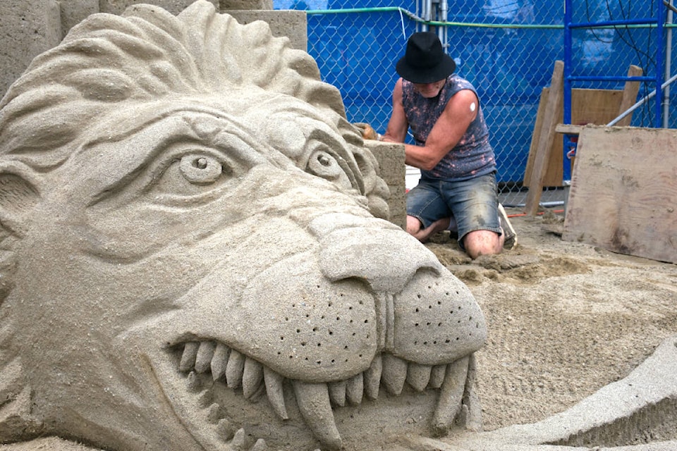 Bruce Waugh, from B.C., works on his masterpiece during the 2022 Quality Foods Sand Sculpting Competition in Parksville on July 17. (Kevin Forsyth photo)
