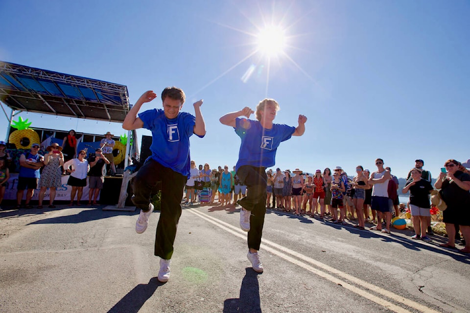 Dance duo Funkanometry dances surrounded by a cheering crowd Saturday during Colwood’s Eats and Beats Beach Party on the Esquimalt Lagoon. (Justin Samanski-Langille/News Staff)