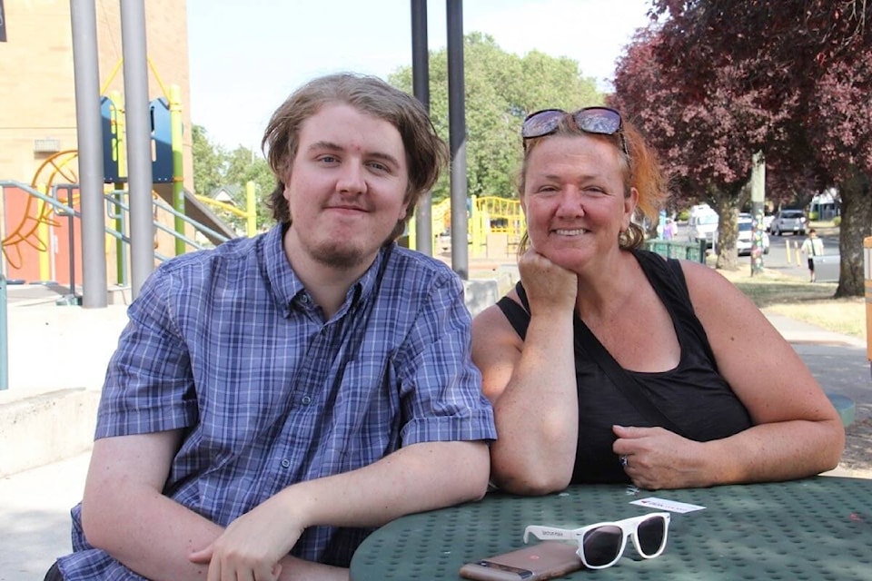 Keygan Power, 18, and Allison Power enjoy some sunshine near where the teen works each day for Byte Camp. (Christine van Reeuwyk/News Staff)