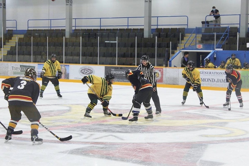 The Ice Dragons (blue) face-off against Coast Classic for the opening puck drop. (Austin Westphal/News Staff)