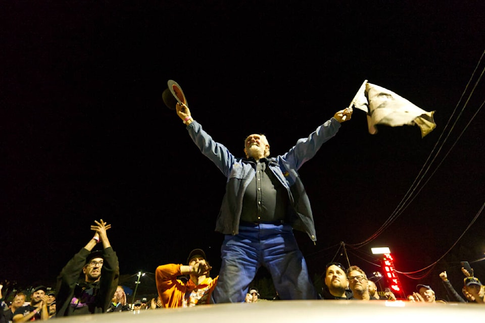 Jim Steen waves to the cheering crowd during the final race night at the Westshore Motorsports Park Saturday, Sept. 17, as the track shuts down permanently. (Justin Samanski-Langille/News Staff)