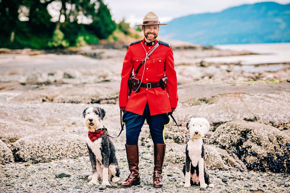 Parker and Jada with Const. Patrick Armstrong of the Sidney/North Saanich RCMP. (Photo by Janis Jean)