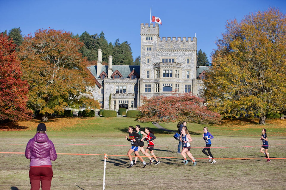 Junior girls run past Hatley Castle Saturday (Nov. 5) during the B.C. High School Cross Country Championships, held at Royal Roads University. (Justin Samanski-Langille/News Staff)