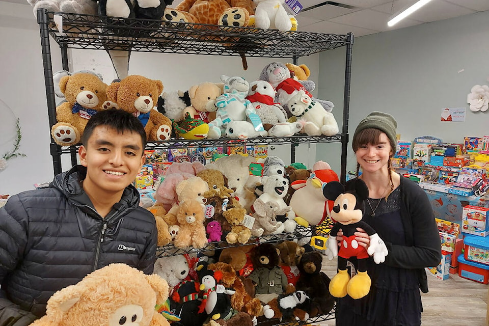 Salvation Army Christmas Assistance Program volunteers Santiago Velasco and Tia-Rose Huber show off part of what will be transformed into a toy shop for parents participating in the program, where they will get to choose some toys for their children. (Courtesy of David Hickman)