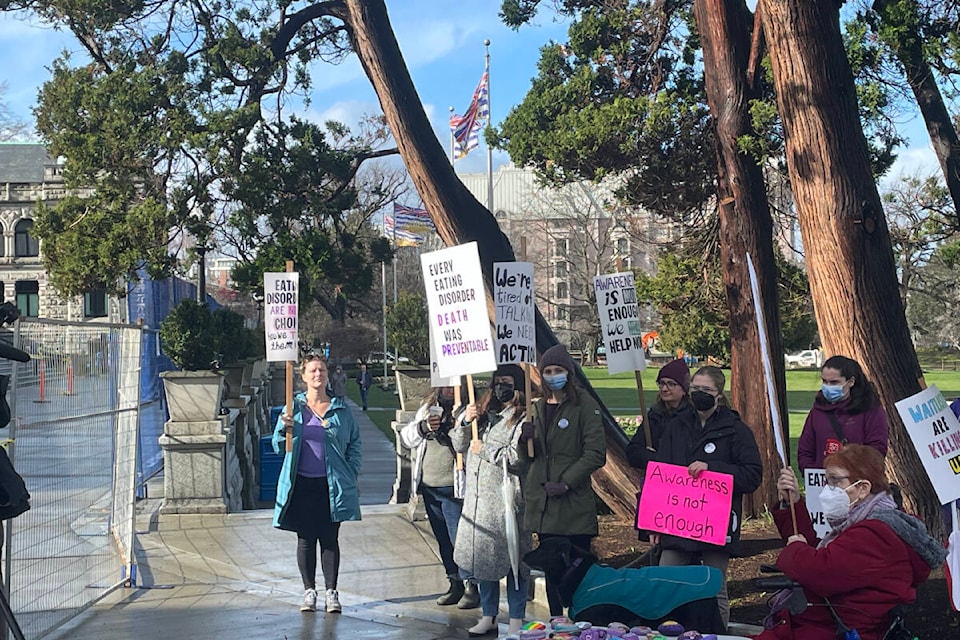 Protesters held a rally at the B.C. Legislature Feb. 7 to call for action, awareness and services for adults who have eating disorders. (Hollie Ferguson/News Staff)