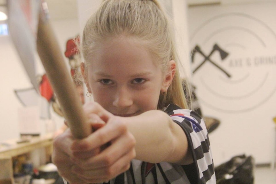 Victoria’s Maddy Mathe, who turned 10 on Feb. 14, is the youngest member in her league axe-throwing and recently certified as an official with the World Axe Throwing League. (Christine van Reeuwyk/News Staff)