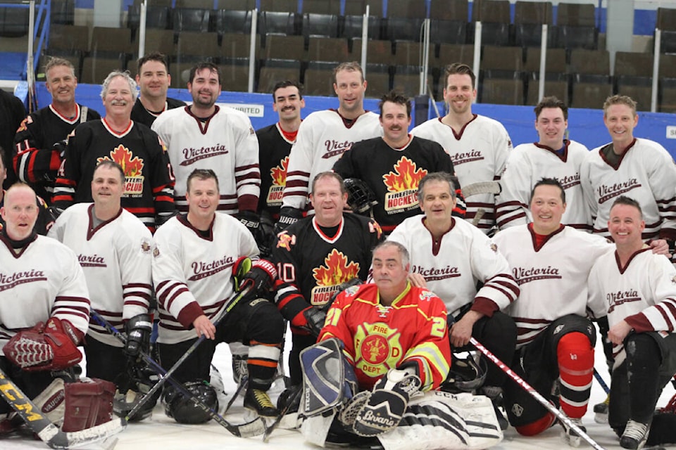 Greater Victoria firefighters team up on Saturday, March 25, at the Archie Browning Sports Centre in Esquimalt to honour fallen firefighters Ken Gill and Forrest Owens. (Hollie Ferguson/News Staff)