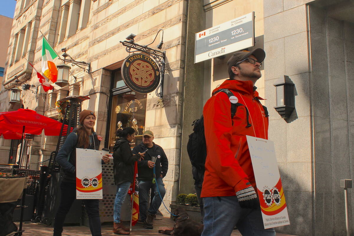 Workers picketed outside a federal building in downtown Victoria on April 19 as nationwide strike actions followed a missed deadline for a new deal to be struck. (Jake Romphf/News Staff)