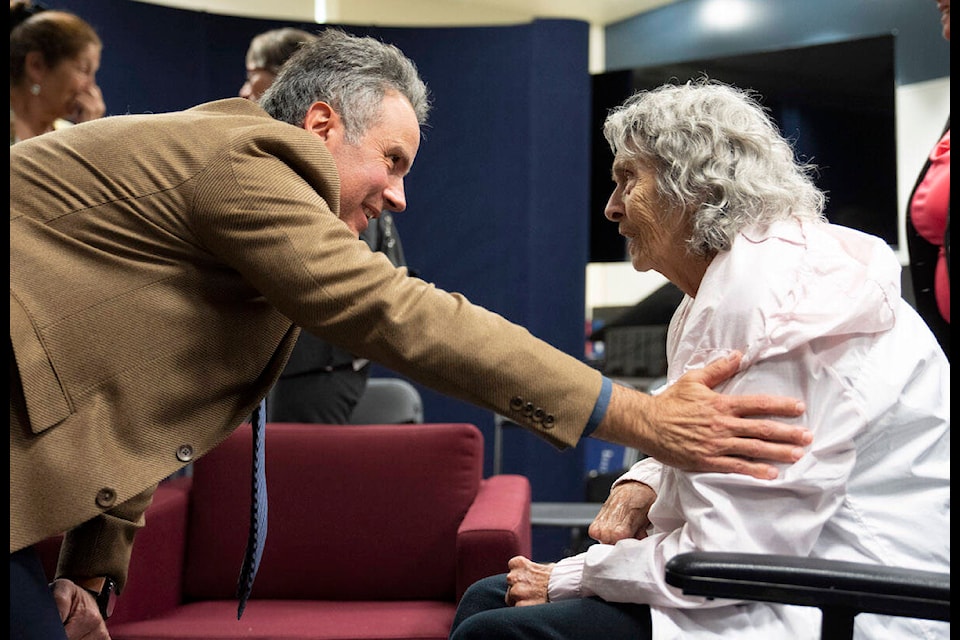 Eric Racicot, Longueuil police detective on the case of the 1975 murder of Sharron Prior speaks with her mother Yvonne following a press conference where the identity of the killer was confirmed on Tuesday May 23, 2023 in Longueuil, Que. THE CANADIAN PRESS/Christinne Muschi